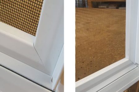 Close-up of secondary fly screen with a white frame, showcasing mesh texture and installation details, relevant to secondary glazing solutions for bay windows.